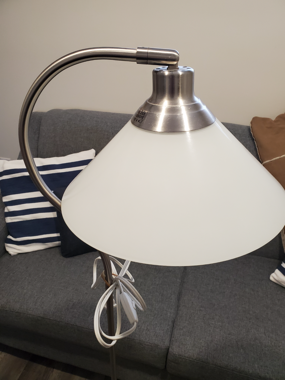 Ikea floor lamp with metal base and white glass shade