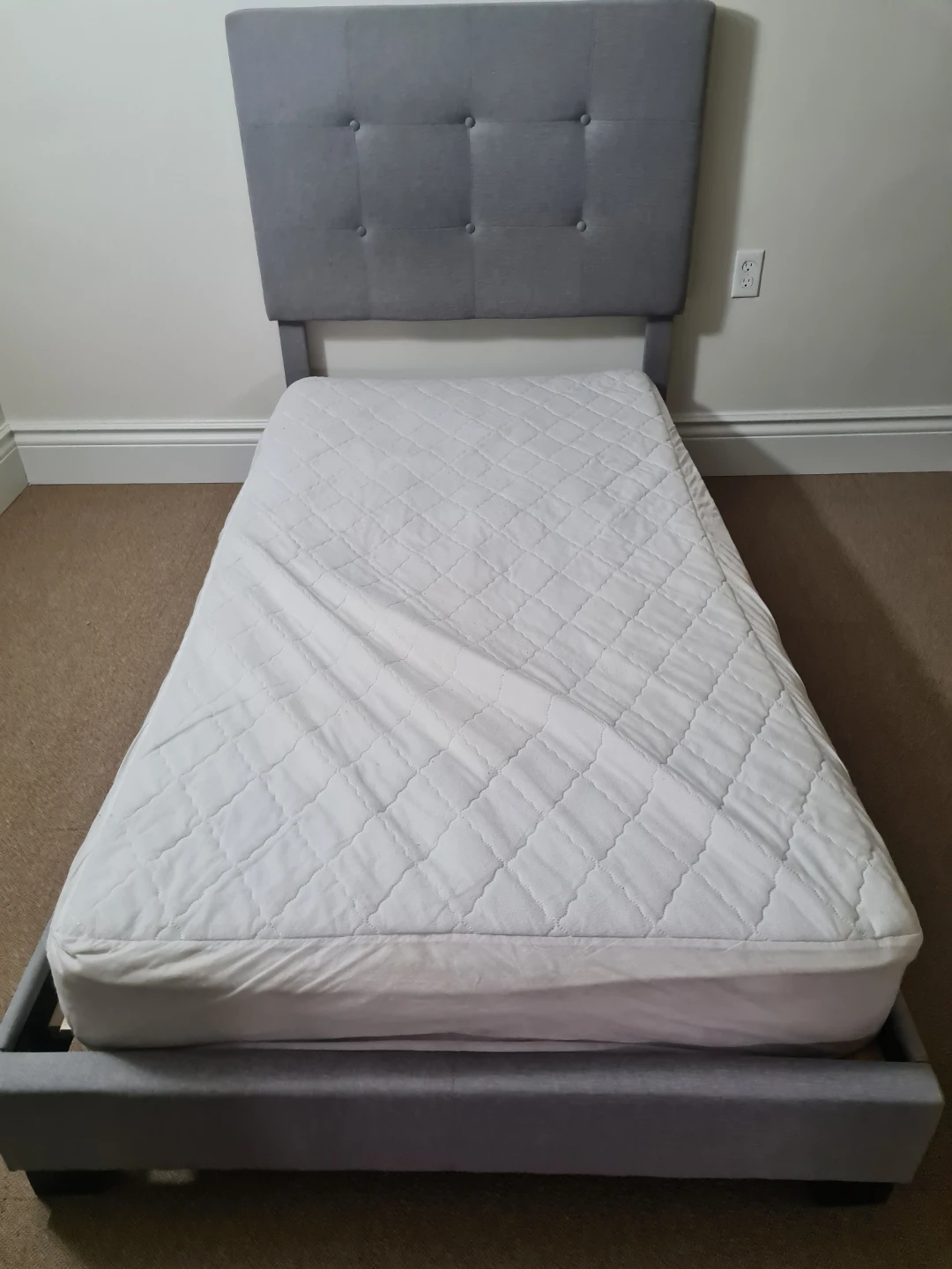 Twin-size bed frame with mattress