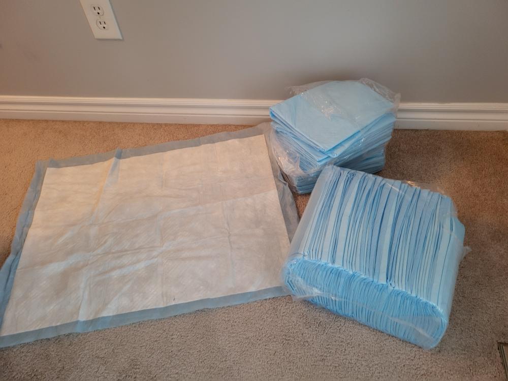 Bulk Pet Pee Pads and One Large Pad