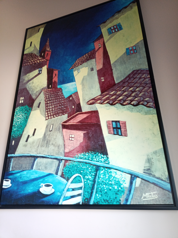 Framed abstract painting of European village scene