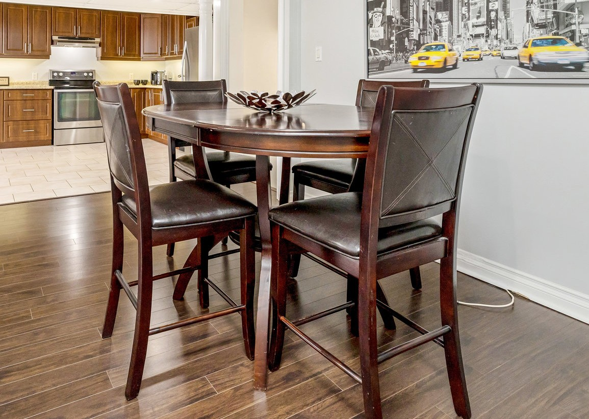Dark Brown Wooden Dining Table with Four Chairs