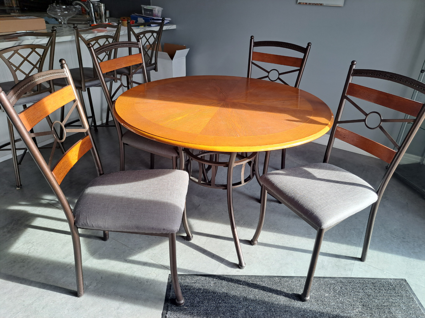 Round dining table with four chairs