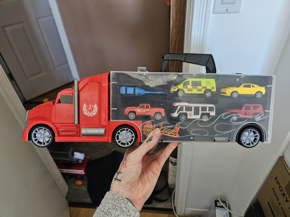 Red Toy Carrier Truck with Multiple Vehicles