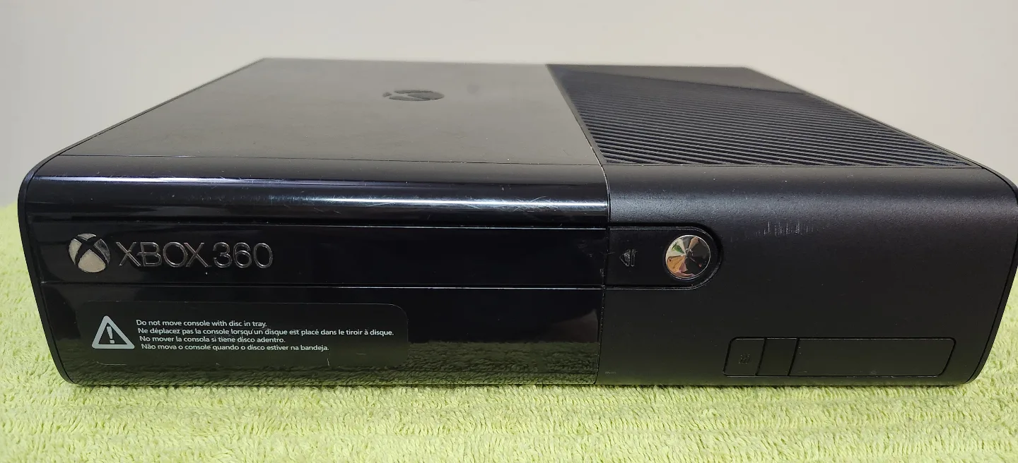 X box 360 e with all wires and wireless controller and 22 games image indicator(2)