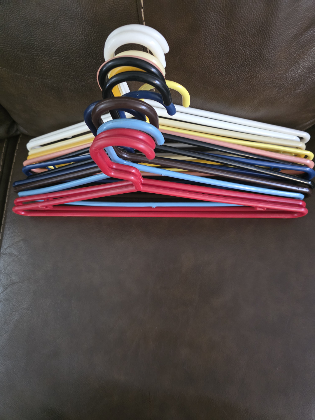 Bulk lot of colorful plastic hangers