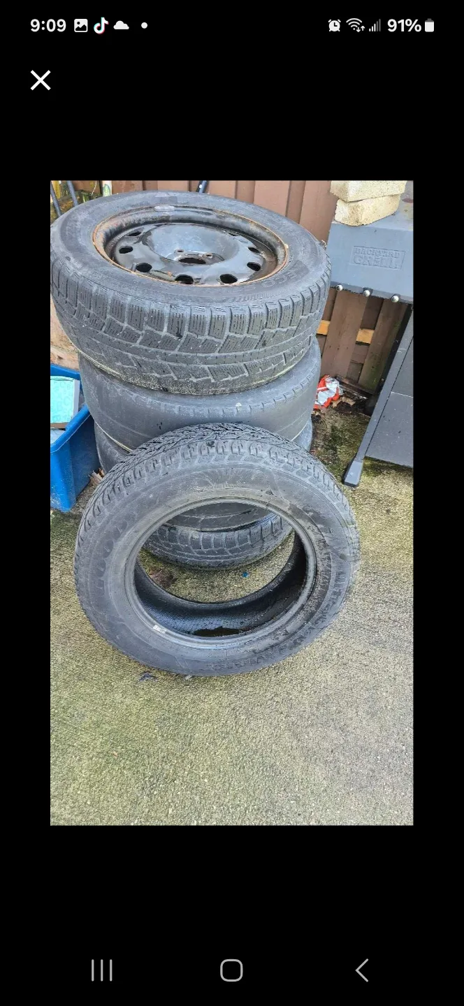 Set of four used winter tires on rims thumbnail
