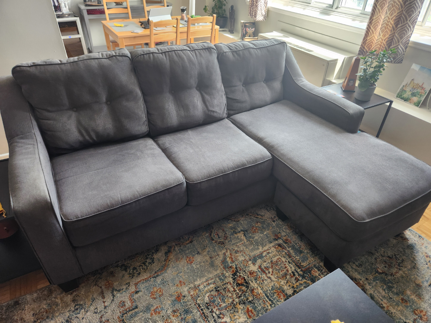 Grey sofa with chair and ottoman