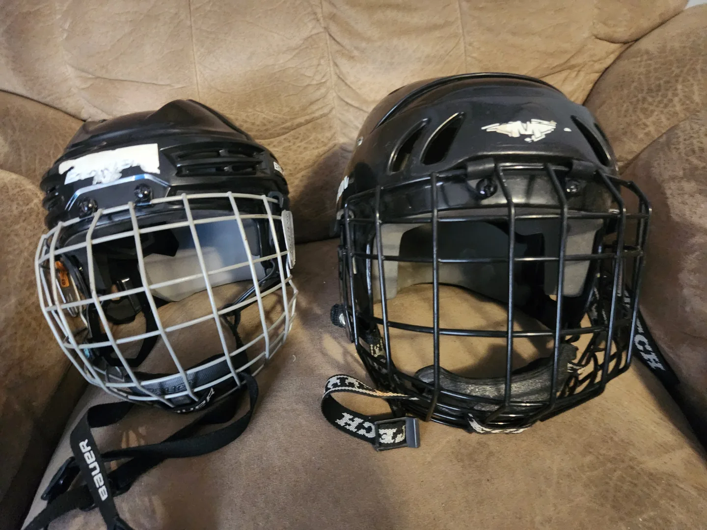 Two Used CCM Hockey Helmets with Cages
