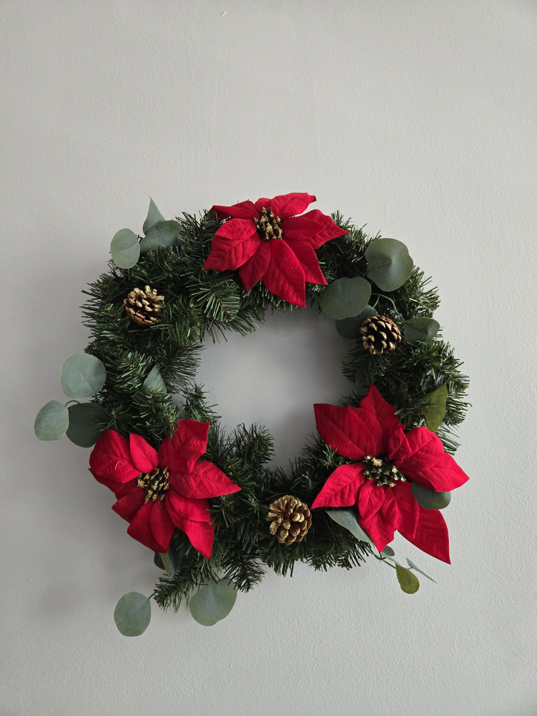 Christmas Wreath with Red Poinsettia and Pine Cones