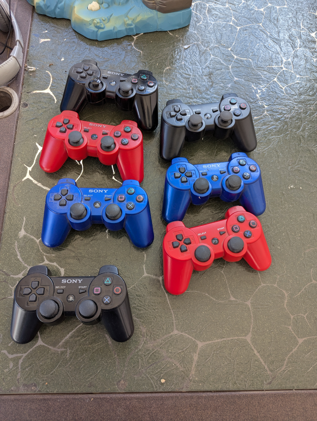 Five PlayStation 3 controllers