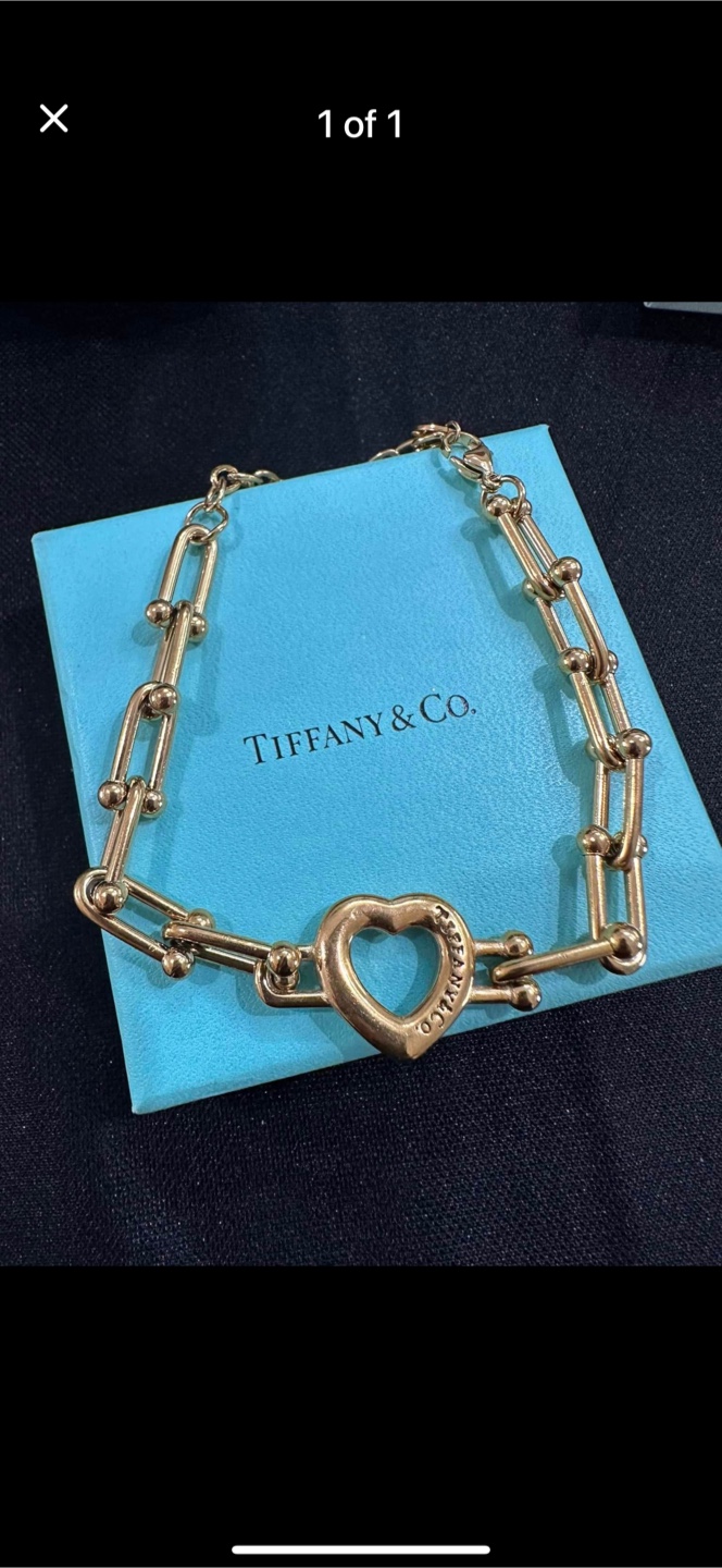 Tiffany & Co. Gold Heart non tarnished hardware material.
