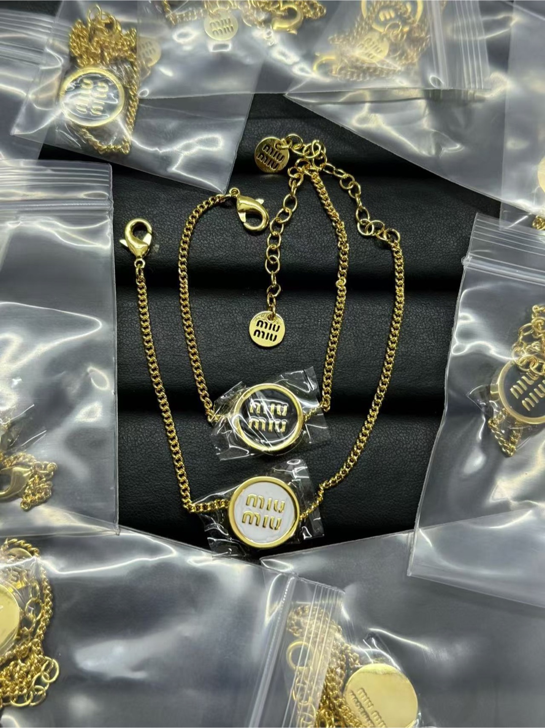 Miu Miu Gold Tone Logo Bracelets