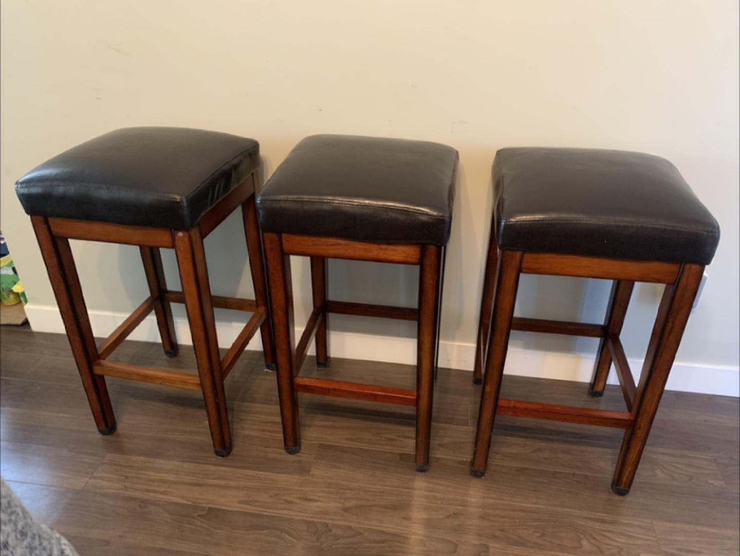 Three Brown Leather Bar Stools