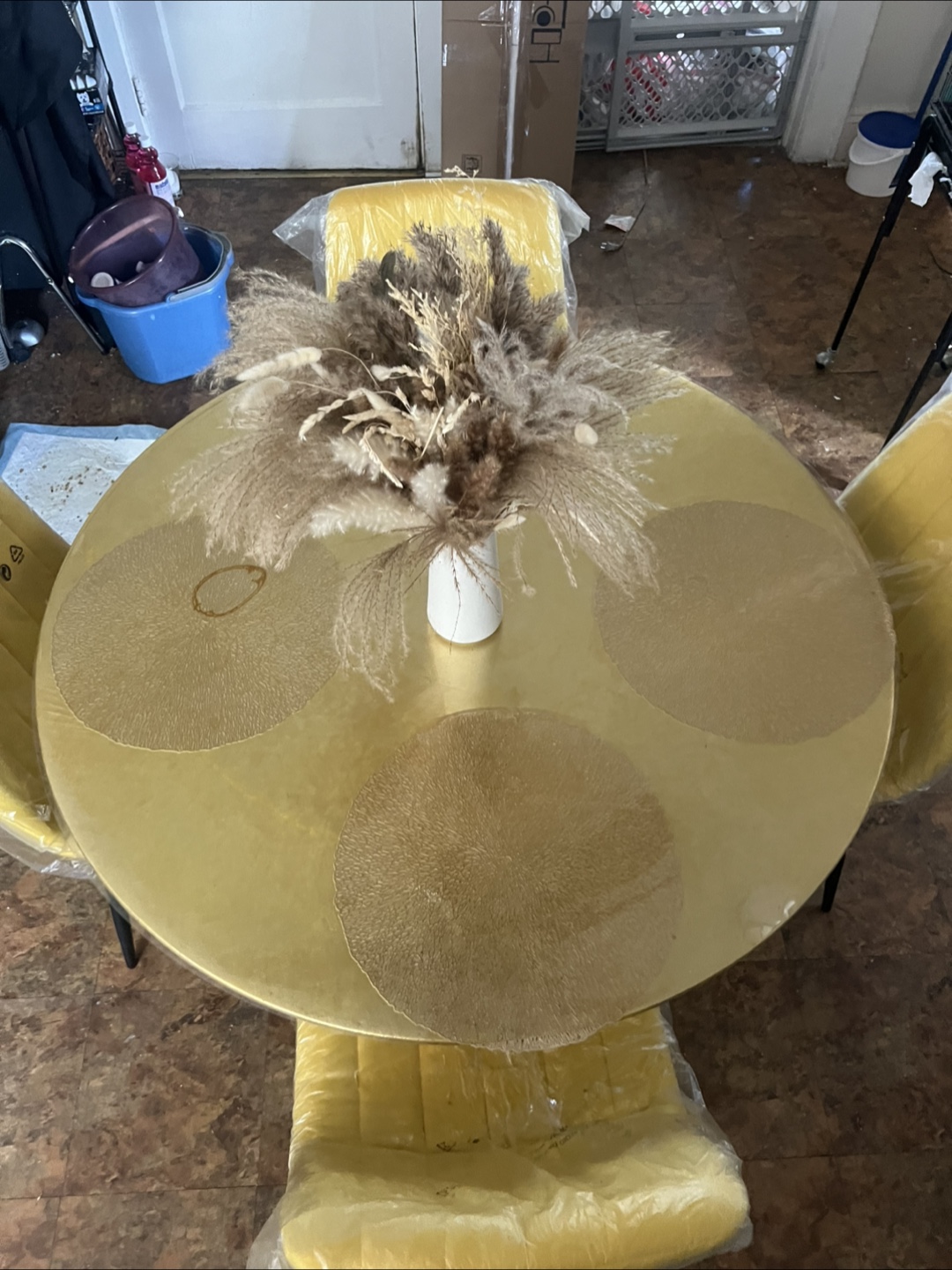 Gold Round Dining Table with Four Mustard Yellow Chairs