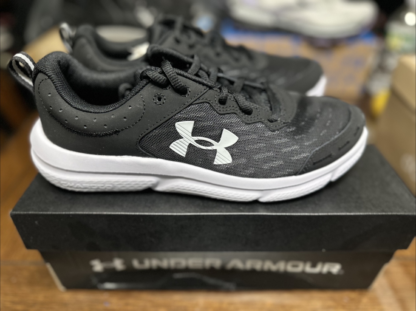 Under Armour women’s Grade School Charged Assert 9 Running Shoes