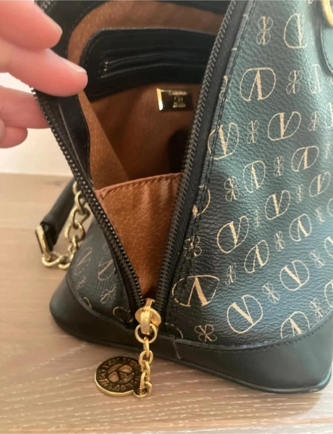 Authentic Valentino Garavani Black and Gold Handbag image indicator(3)