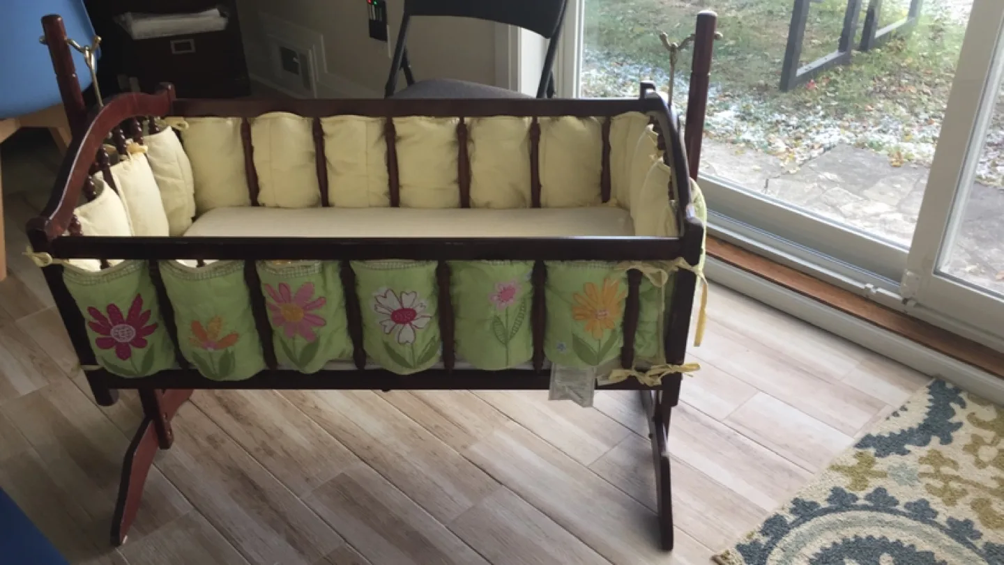 Wooden Baby Cradle with Floral Bedding thumbnail