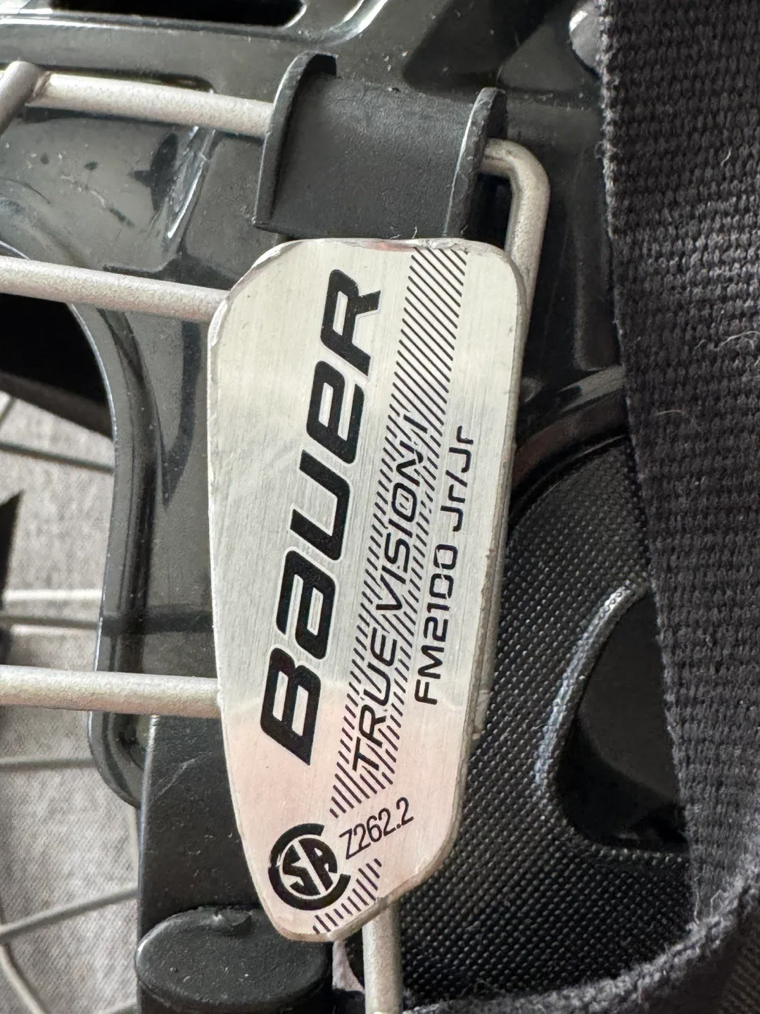 Two Bauer Hockey Helmets with Cages image indicator(2)