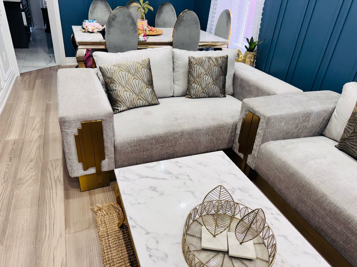 Elegant Grey Sofa with Gold Accents
