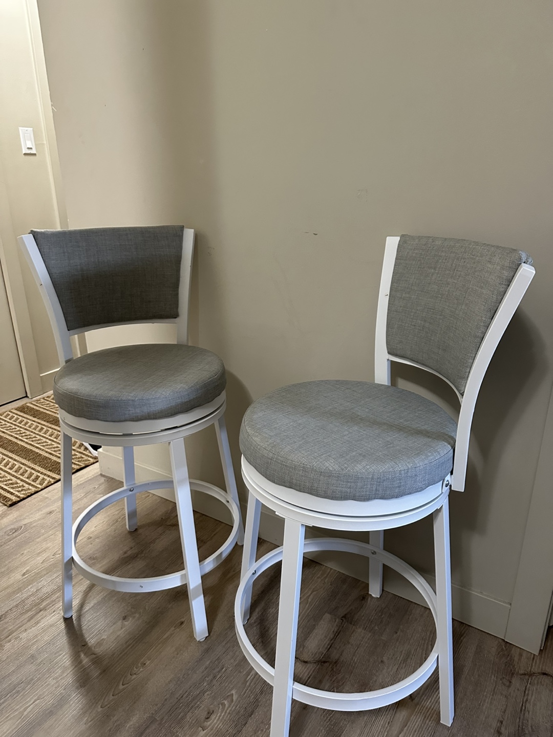Brand-new set of two 25″ round swivel bar stools with backrests