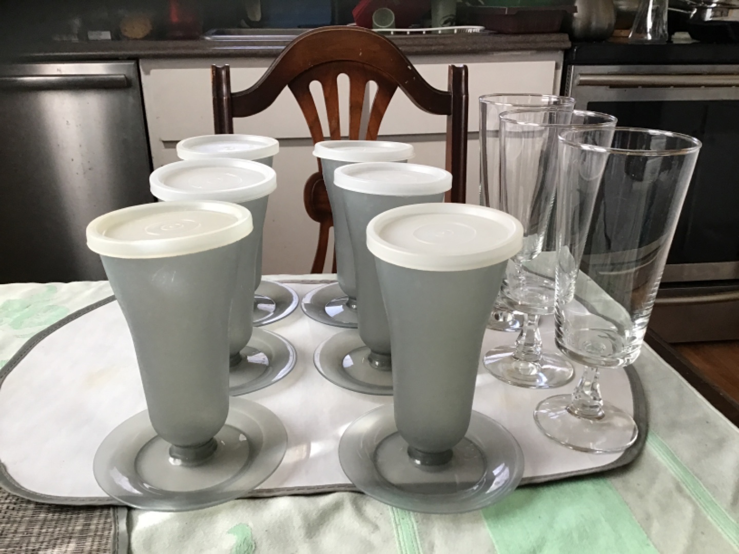 Six Grey Dessert Cups with Lids and Four Tall Stemmed Glasses
