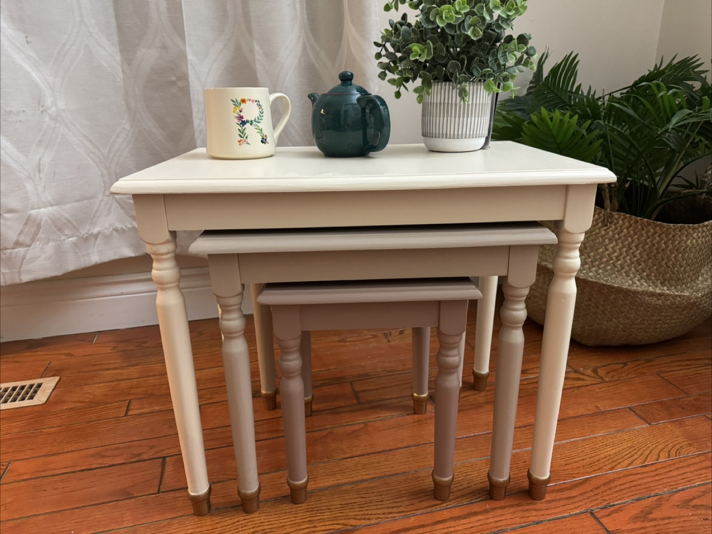 Nest of three painted tables