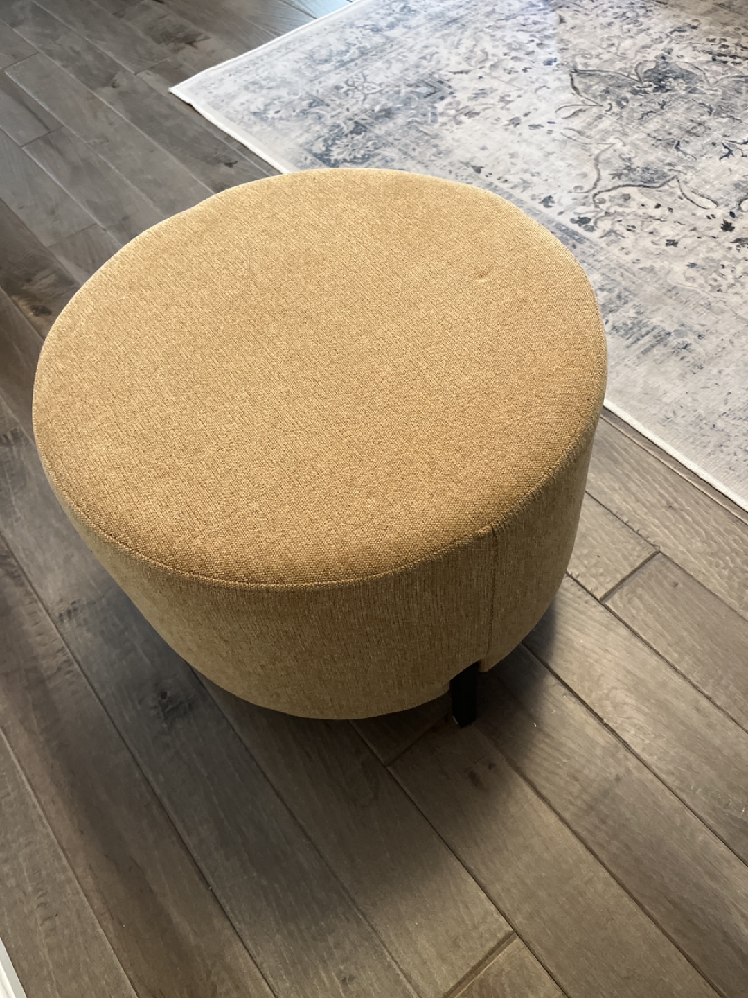 Round Upholstered Ottoman with Black Legs - photo 3