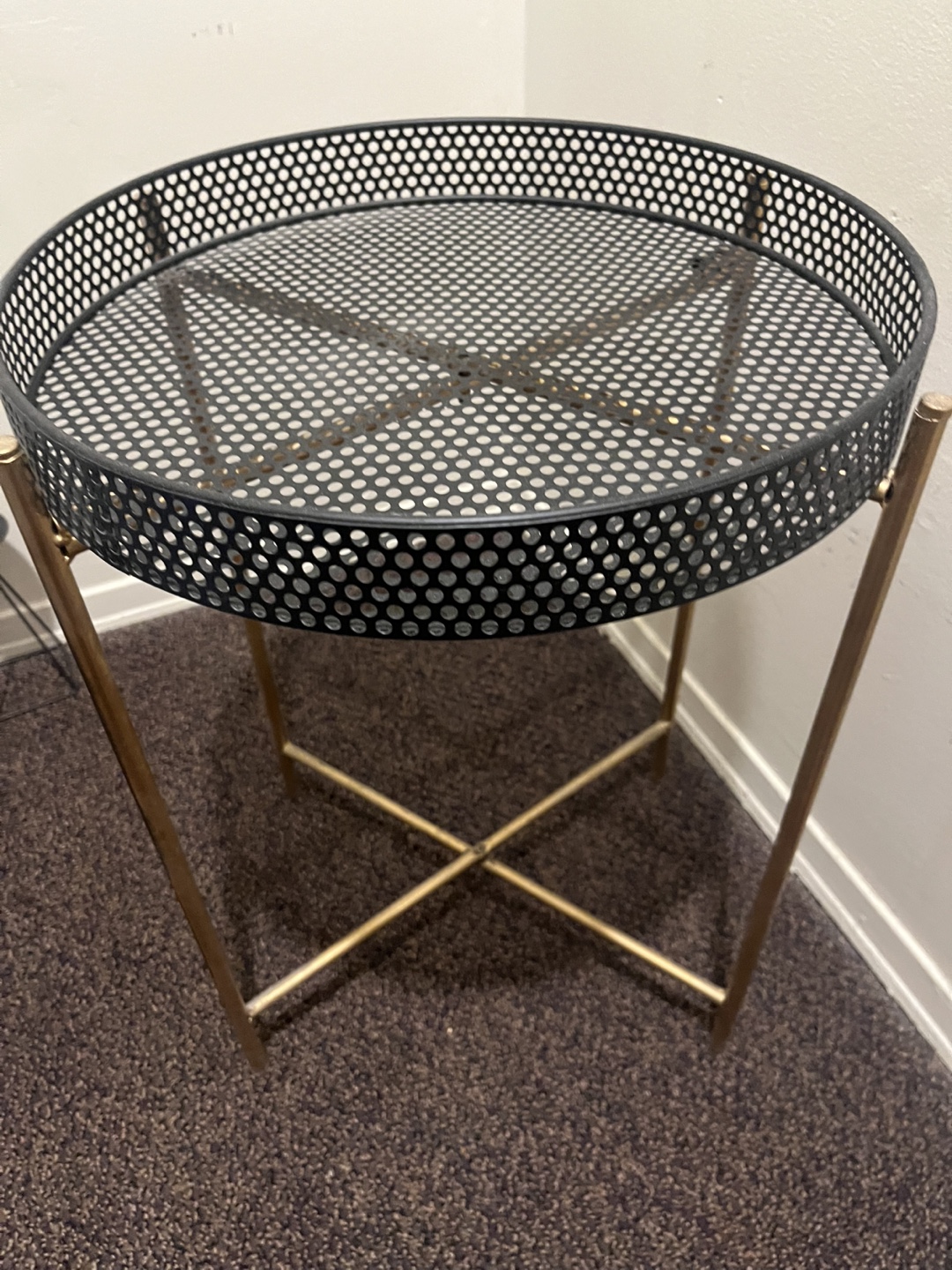 Metal side table with perforated top