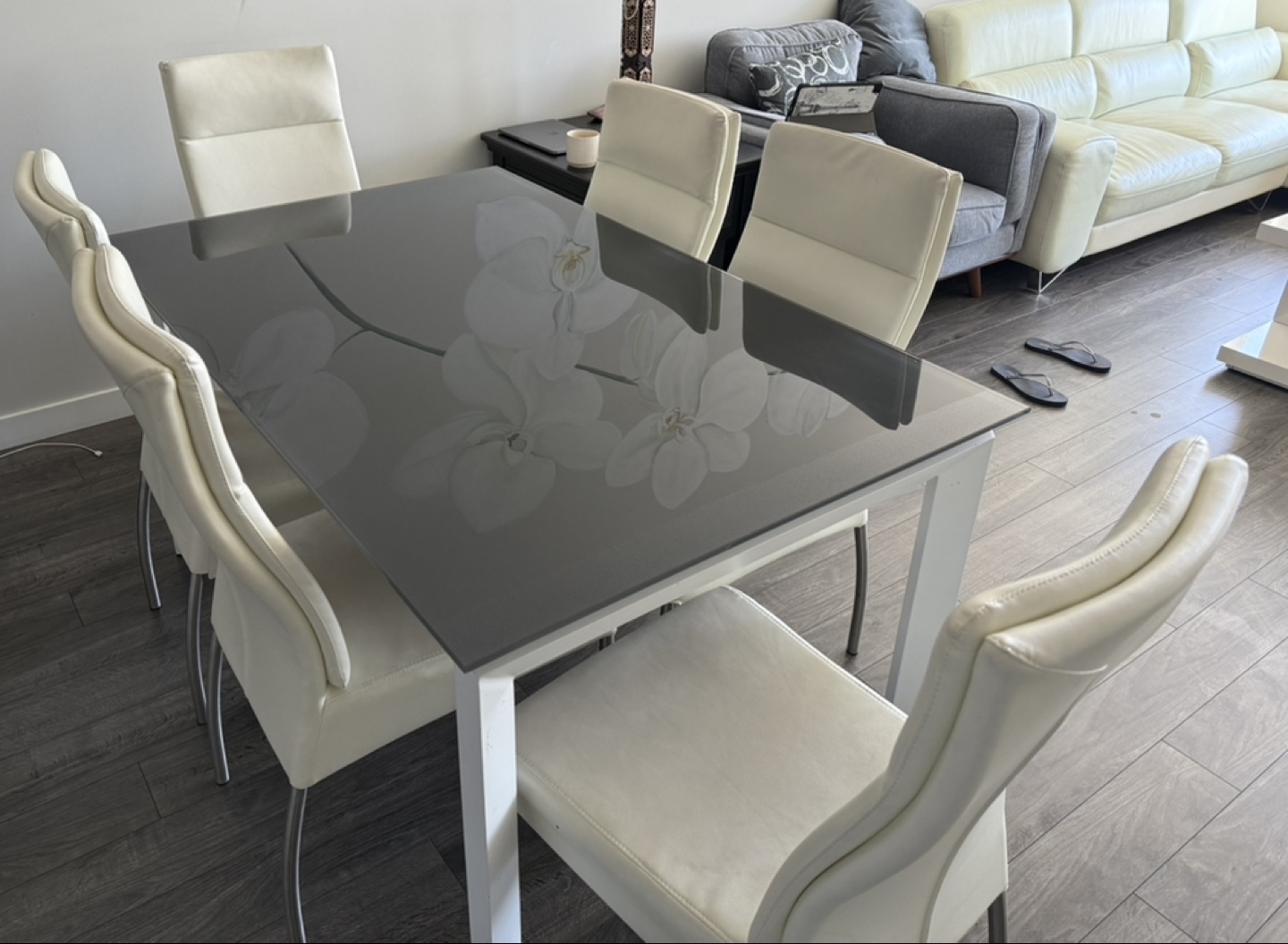 Modern Glass Dining Table with Six Cream Leather Chairs