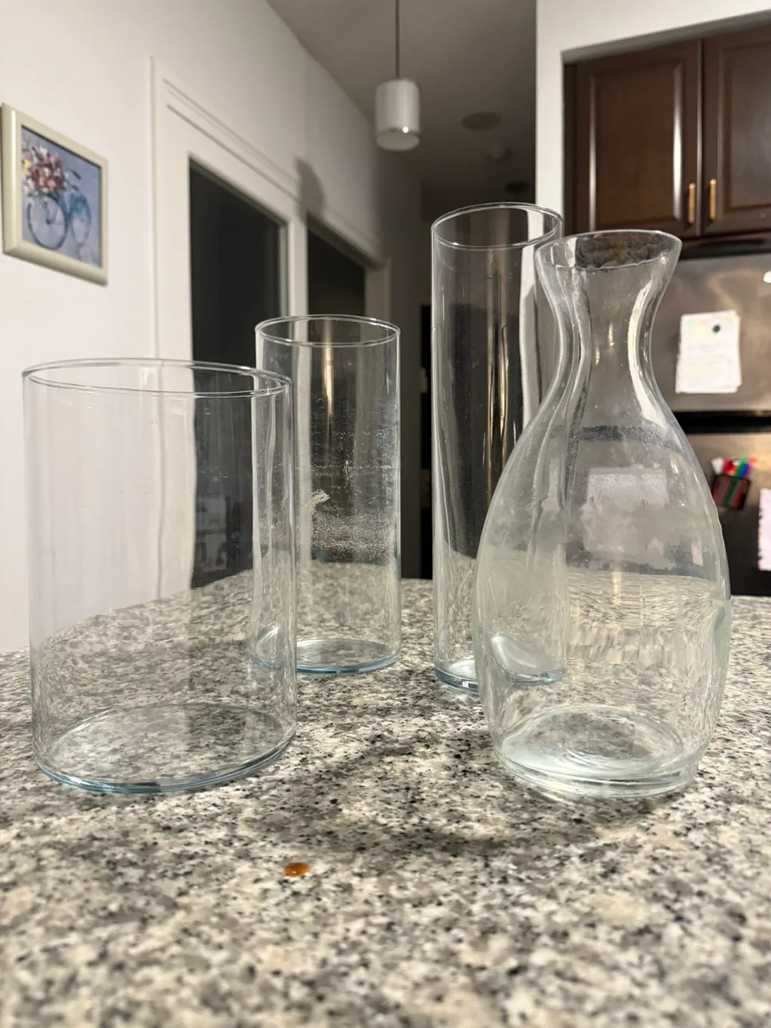 Set of four clear glass vases thumbnail