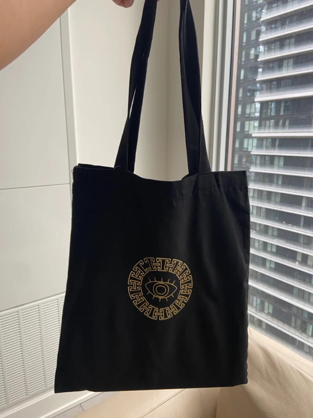 Black Tote Bag with Gold Evil Eye Design image indicator(2)