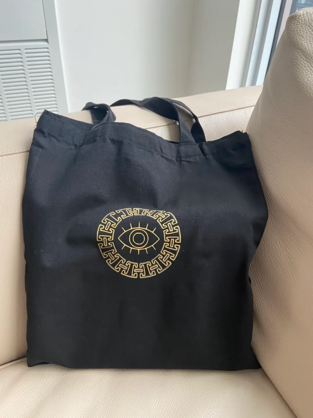 Black Tote Bag with Gold Evil Eye Design thumbnail