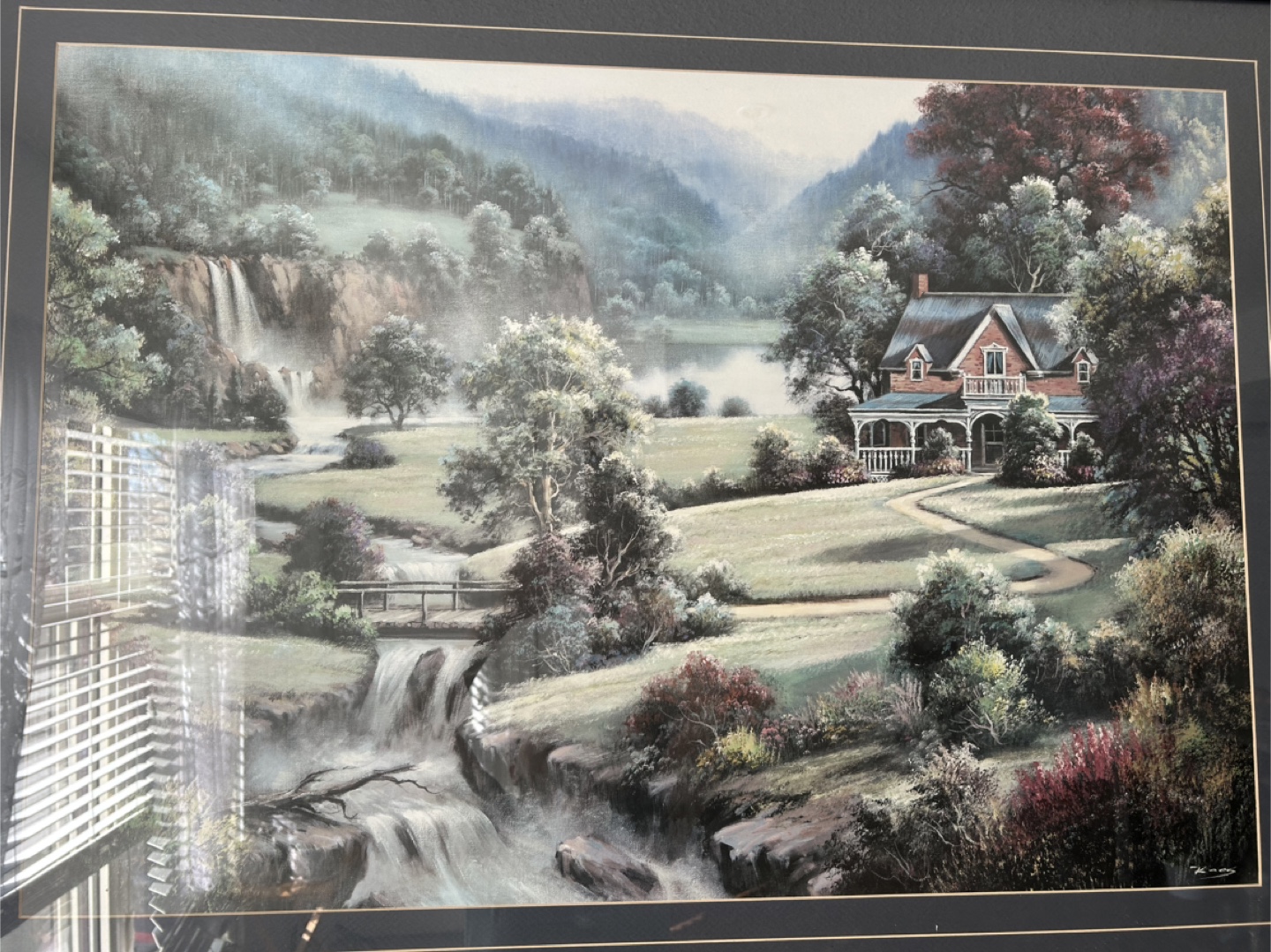 Framed Thomas Kinkade-style landscape painting