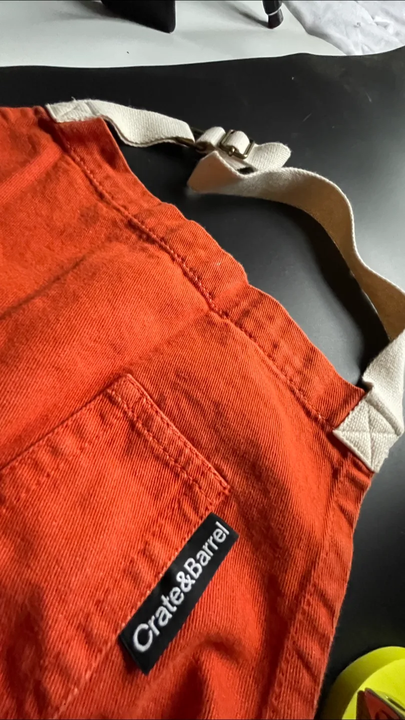 Crate & Barrel Burnt Orange Apron thumbnail