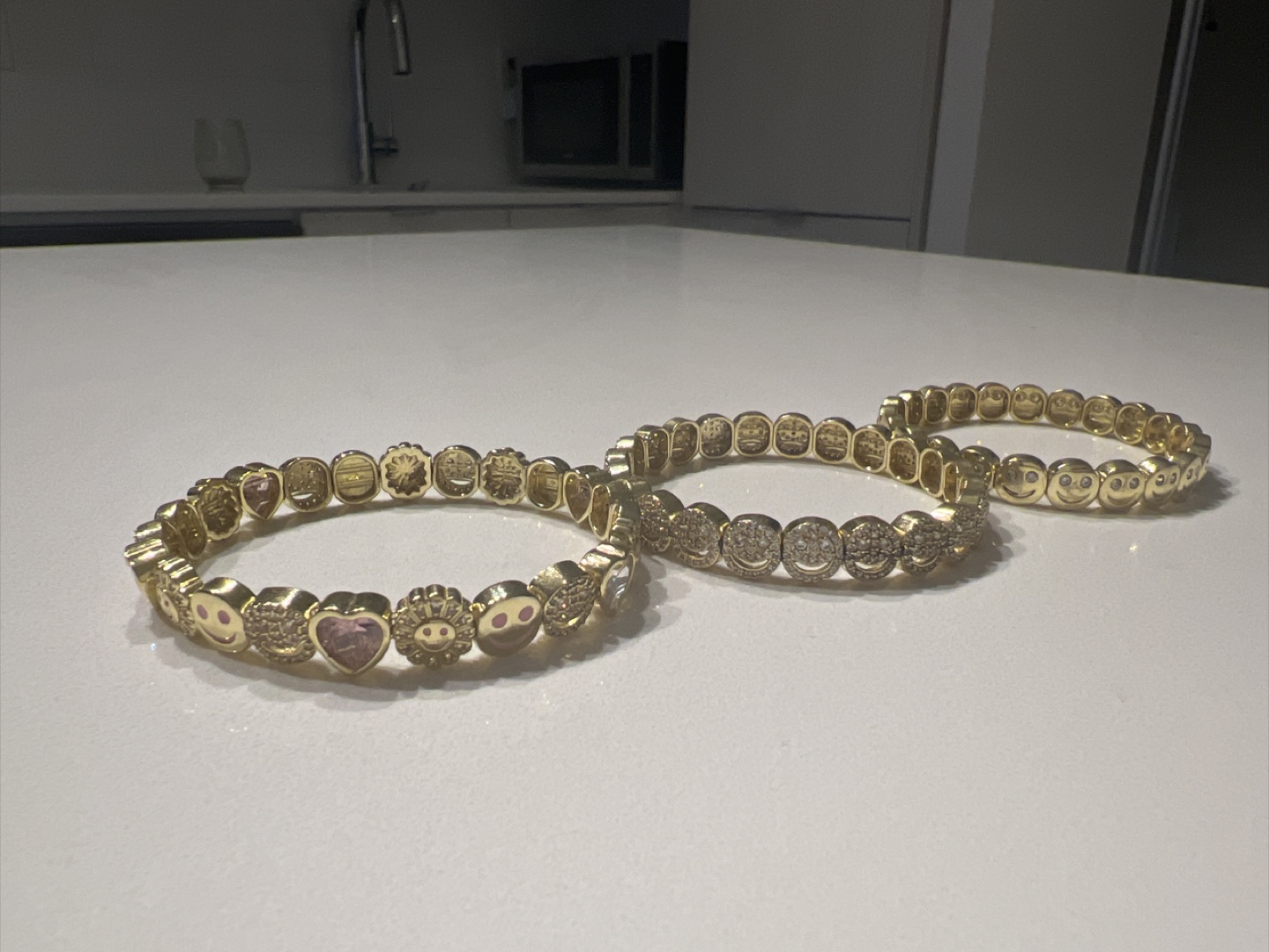 Set of three gold smiley face bracelets - photo 2