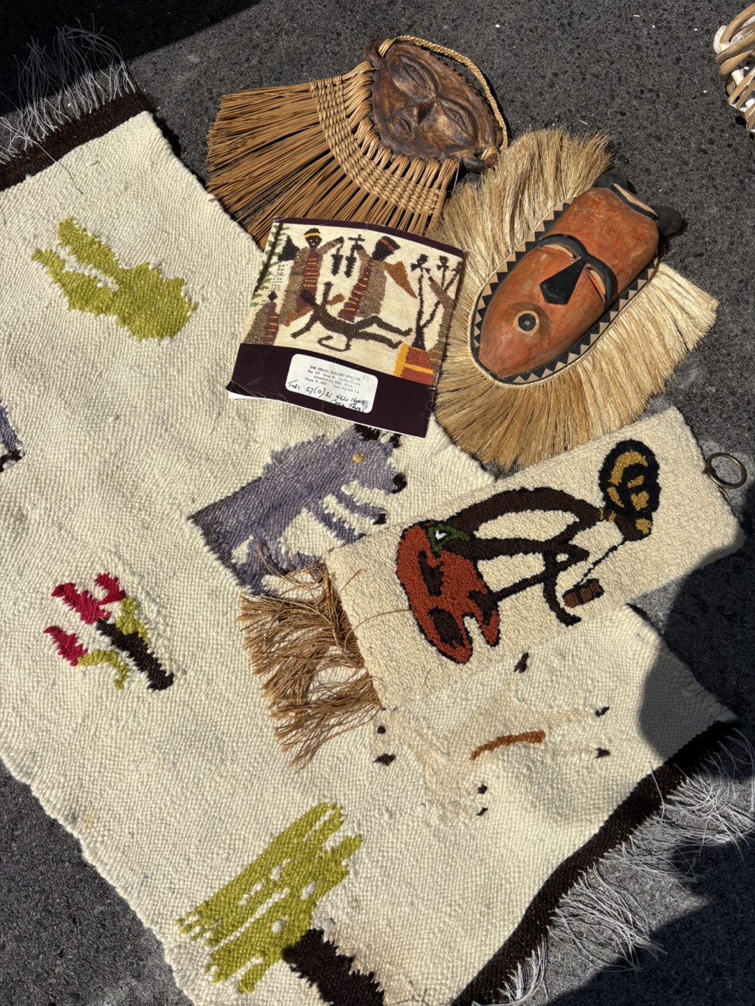 African tribal masks and handwoven rugs