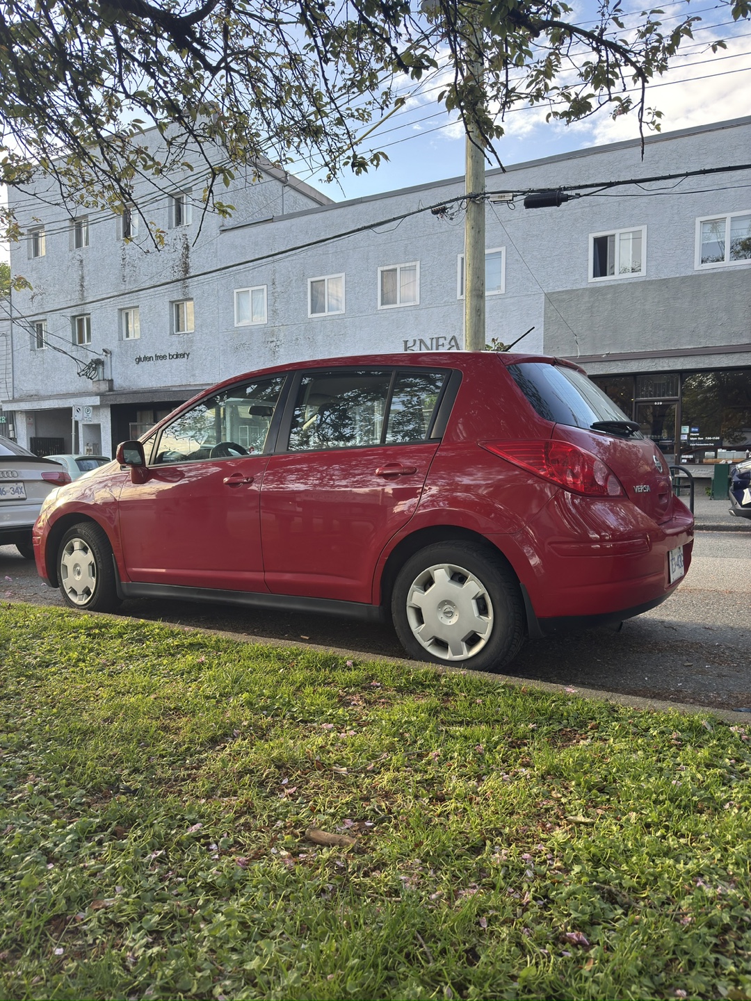 Red Nissan Versa Hatchback - photo 2
