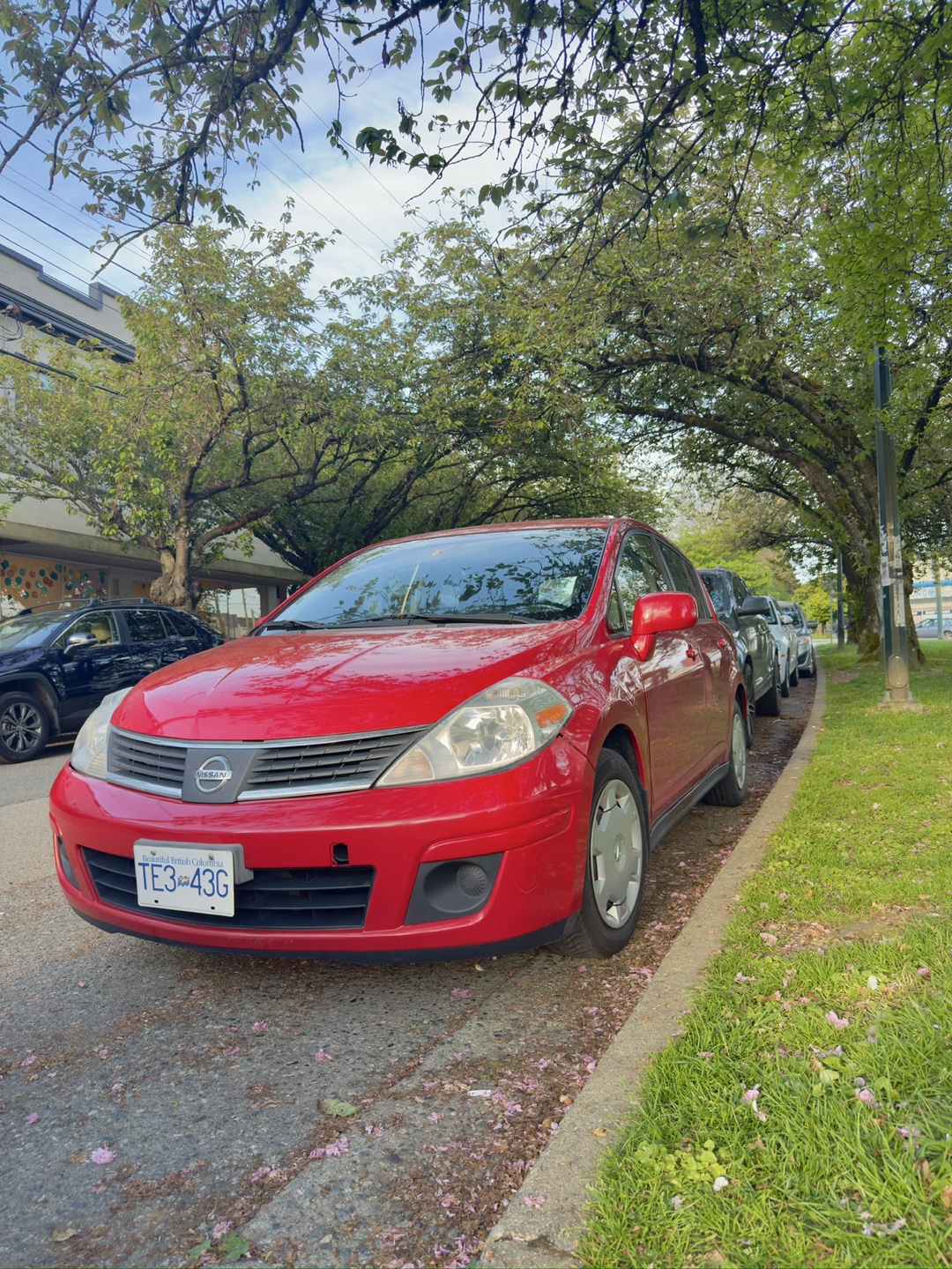 Red Nissan Versa Hatchback