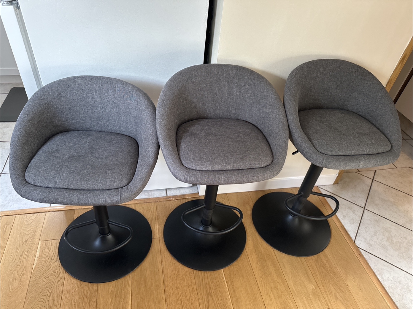 Set of Three Grey Fabric Adjustable Bar Stools