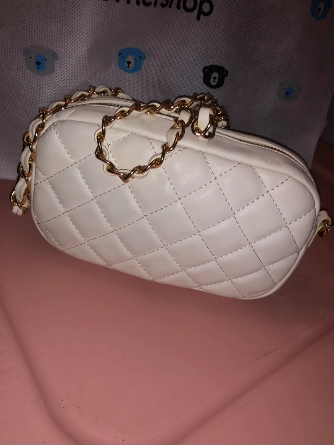 Cream quilted crossbody bag with gold chain strap thumbnail