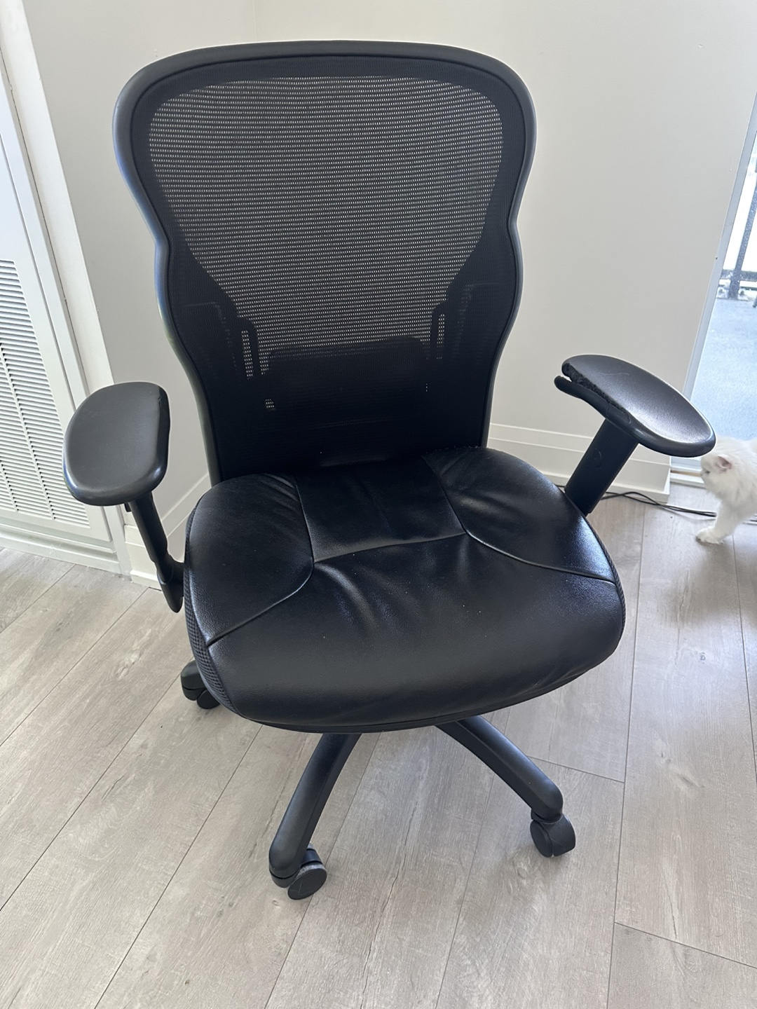Used Black Mesh Office Chair with Damaged Armrest
