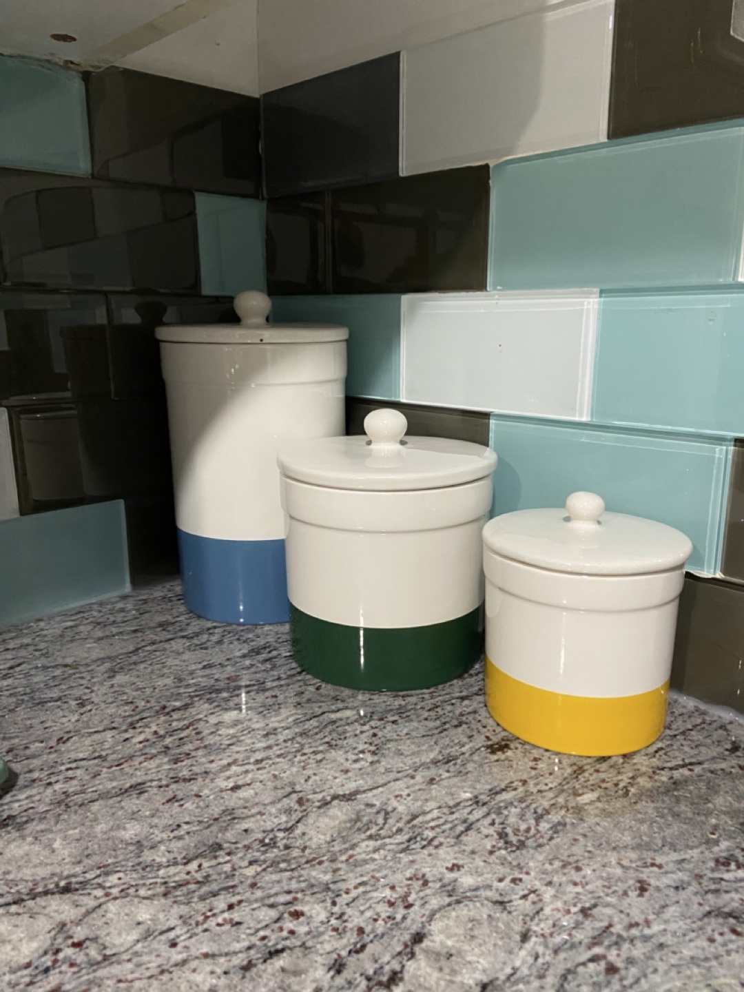 Set of 3 ceramic canisters with coloured bands