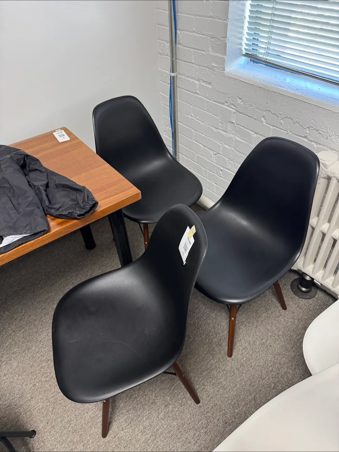Three Black Plastic Dining Chairs with Wooden Legs thumbnail