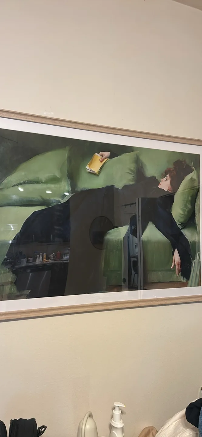 Framed Painting of Woman Reclining on Green Couch thumbnail