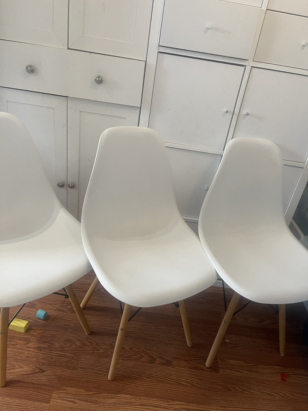 Set of three white dining chairs