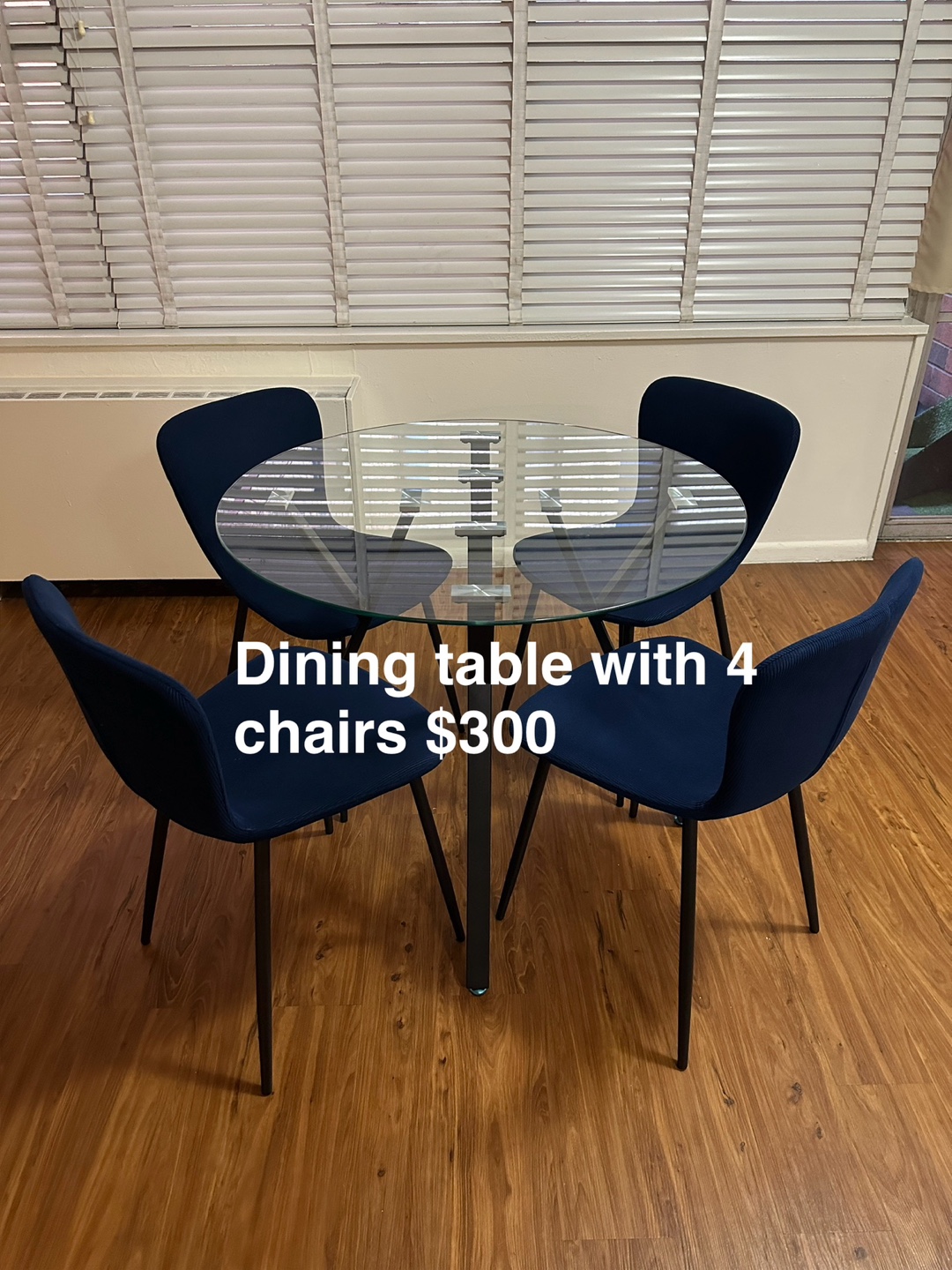 Glass Dining Table with Four Navy Blue Chairs