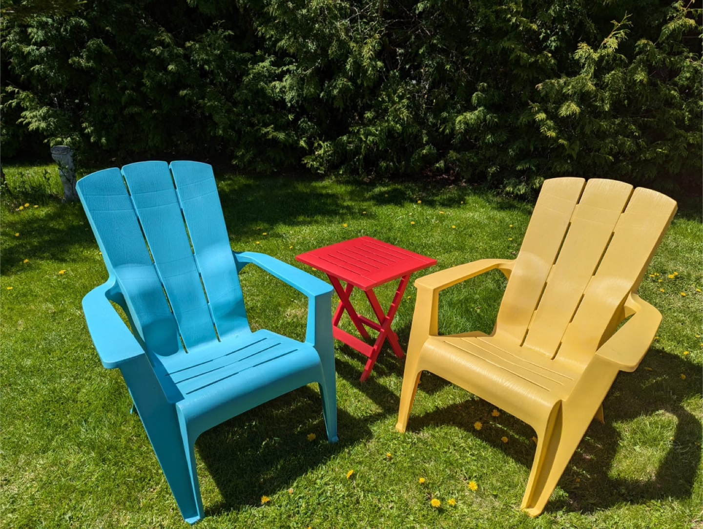 Moulded plastic resin Muskoka chairs and Table