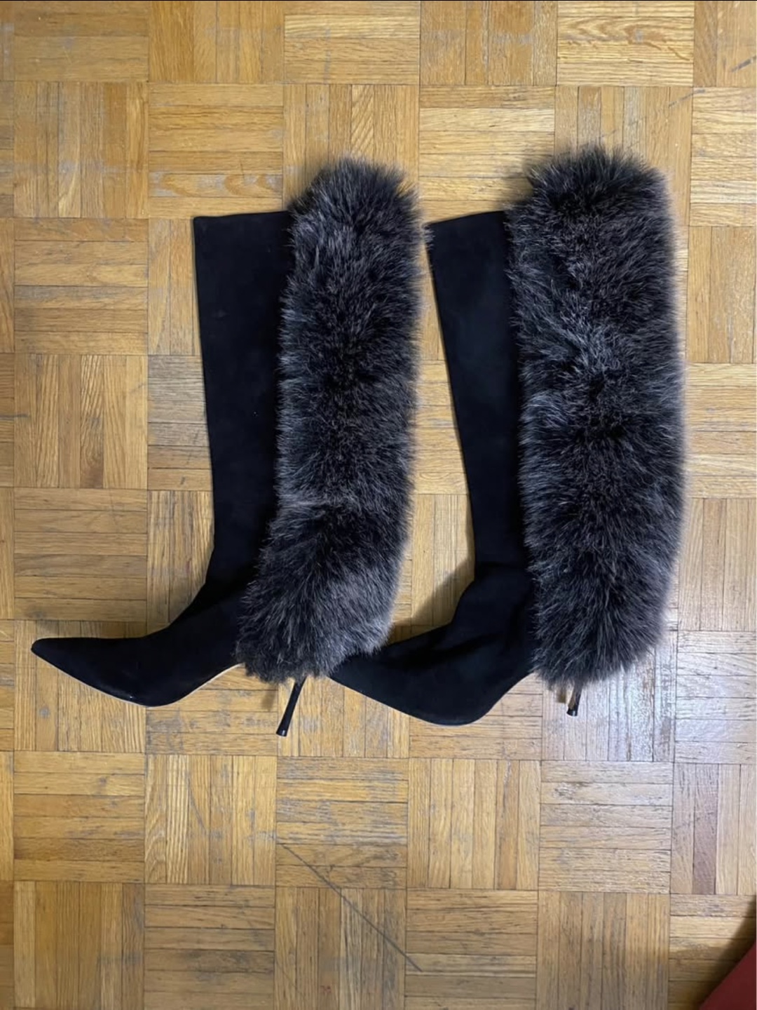 Black suede knee-high boots with grey fur trim