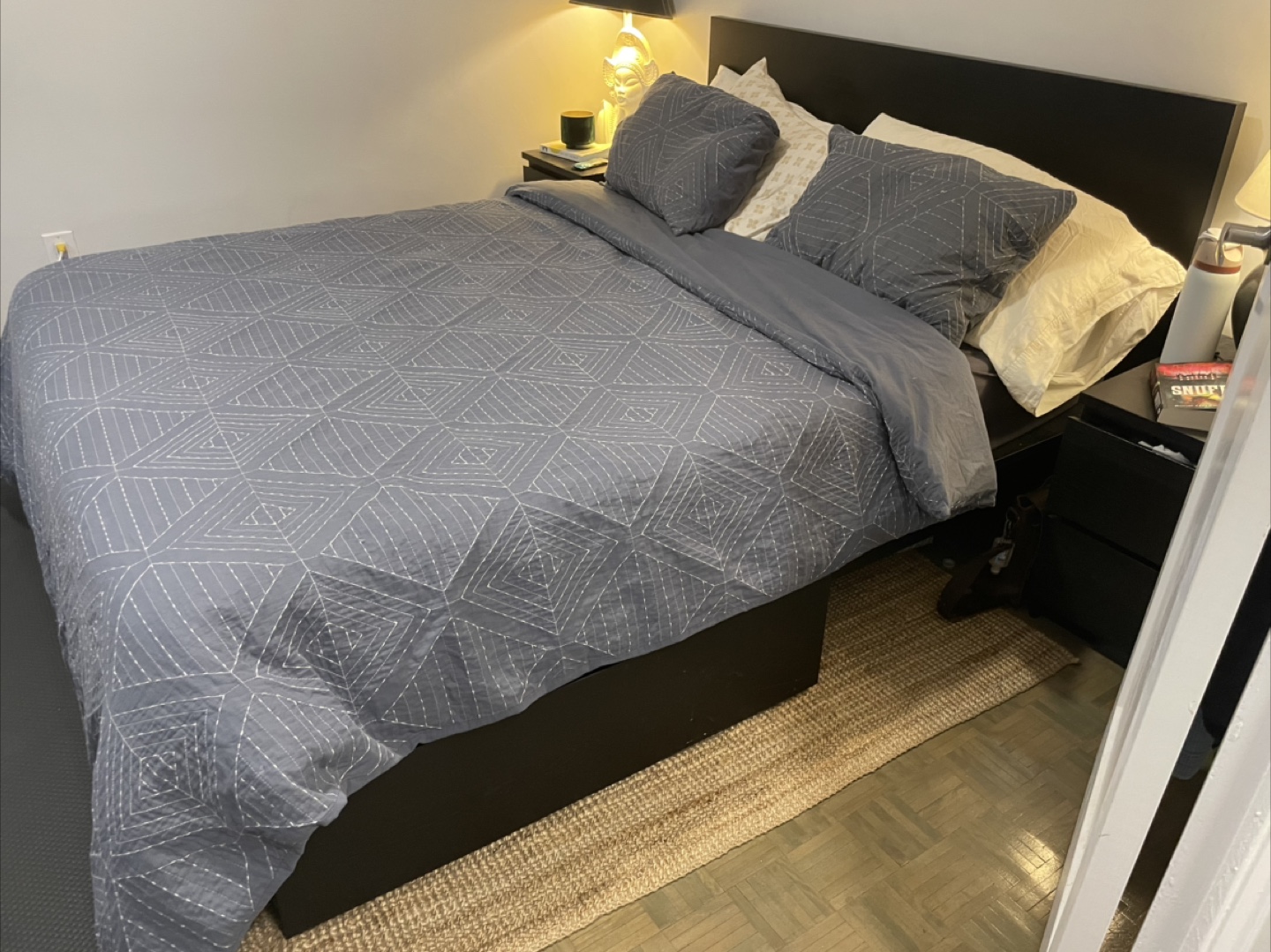 Queen-size IKEA MALM bed frame with storage drawers
