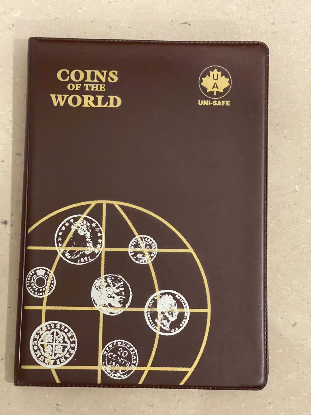 Uni-Safe Coins of the World Album with Various Foreign Coins thumbnail